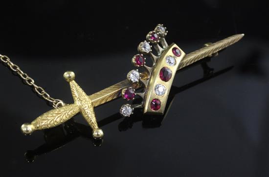 An early 20th century gold, ruby and diamond set coronet and sword brooch, 59mm.